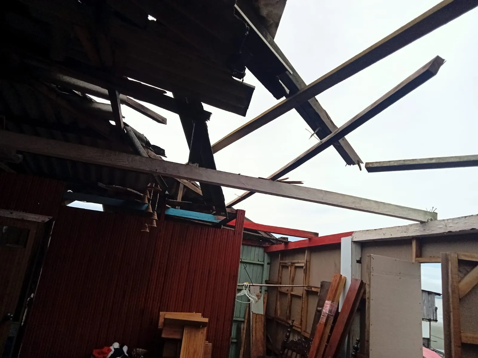 Interior roof damage at La Sazón de Fanny after the earthquake